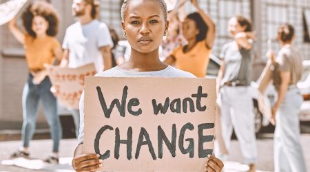 black-woman-protest-group-and-sign-about-peace-j-2023-11-27-05-32-25-utc.jpg